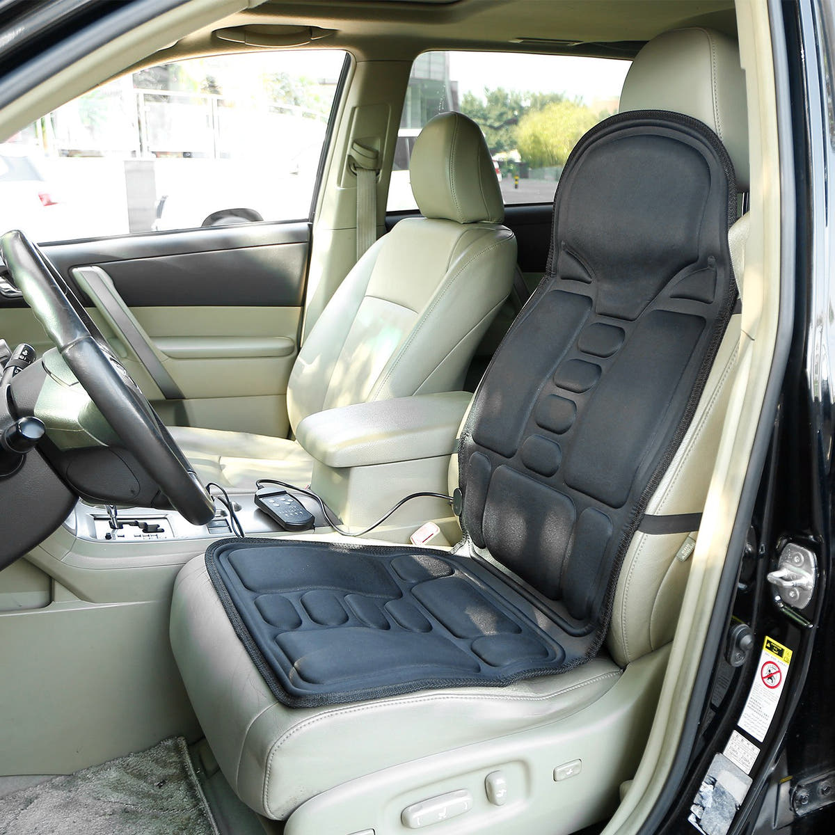 Car seat massager cushion installed on a car seat