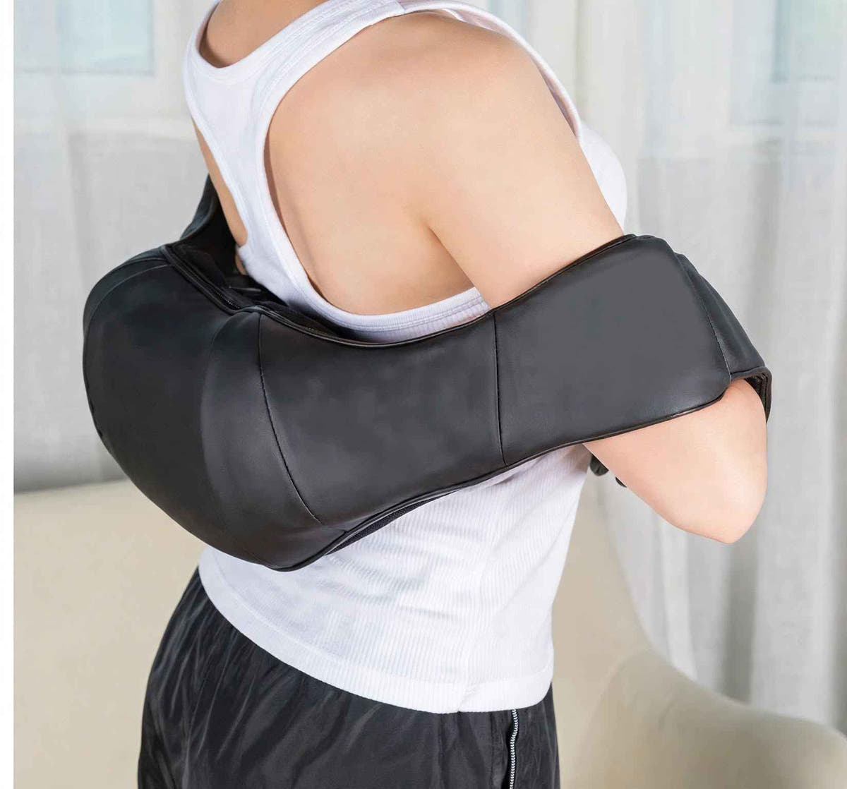 Shiatsu neck and shoulder massager worn over the shoulder