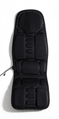 Car seat massager cushion flat lay, straight overhead view, white background